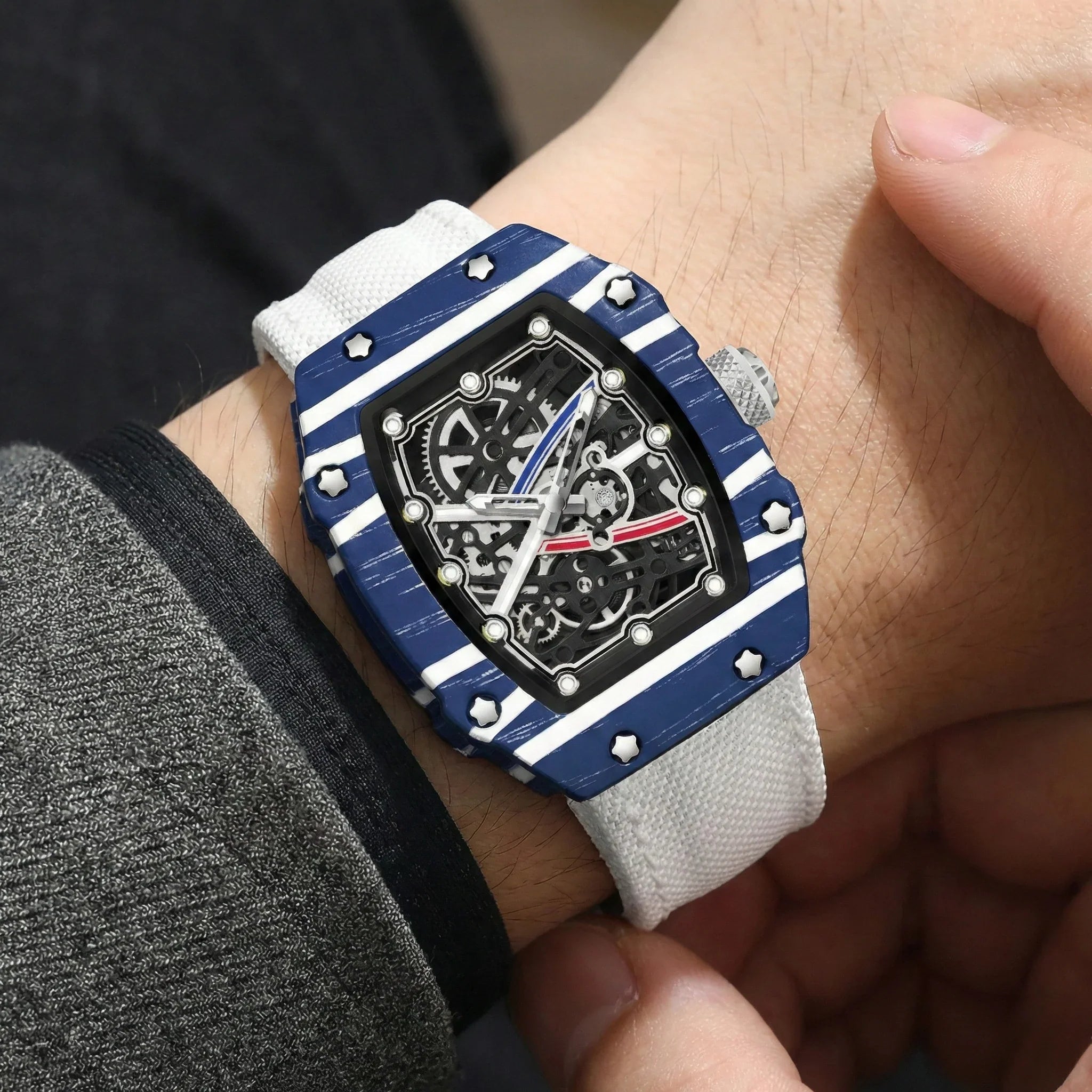Skeleton Tonneau Sport Watch by GIORGIO MARENO featuring a skeleton dial and tonneau-shaped stainless steel case.